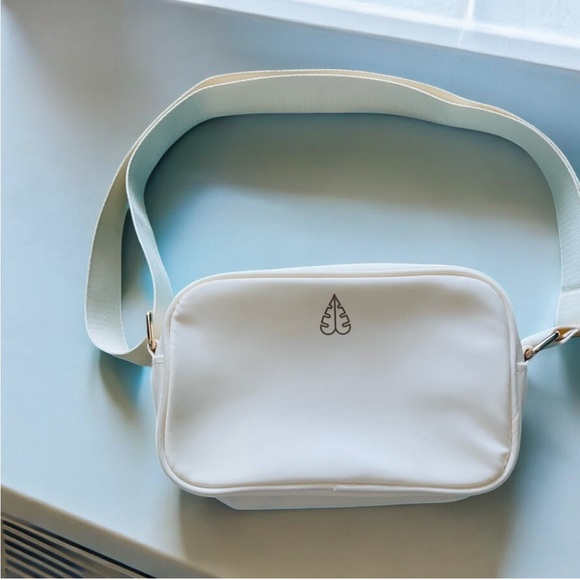 Biossance Handbags - Biossance crossbody cosmetic bag